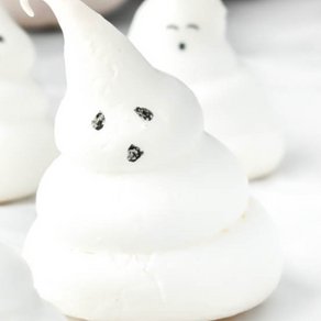 3 blobs white meringue with a happy face on the top blob