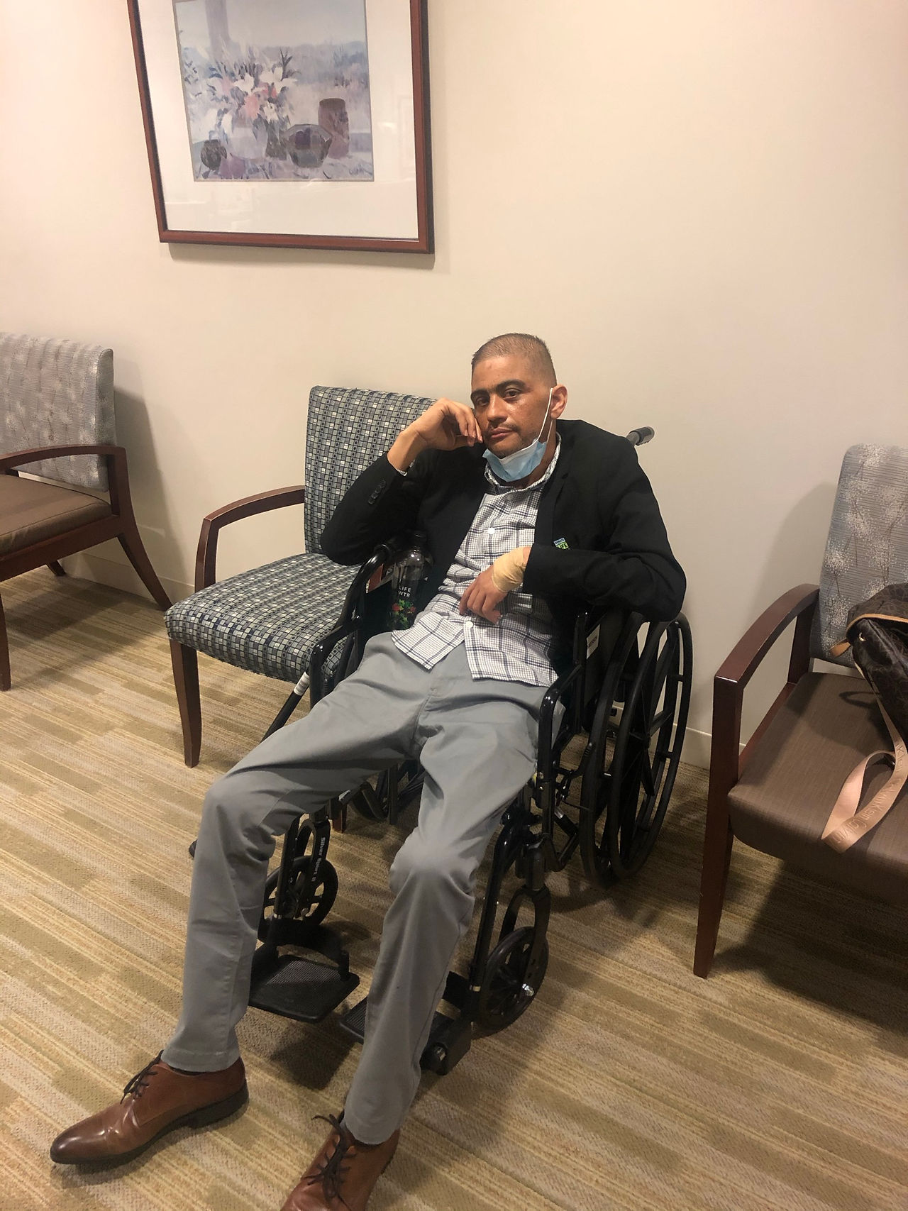 Leo in a wheelchair slowly recovering after his double lung transplant.