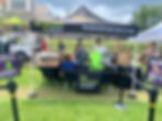 Two Infinite Legacy team members handing out The Decision Project backpacks at a Block Party in Maryland. 