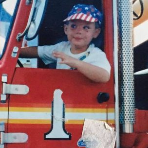 Zach sits in a truck.