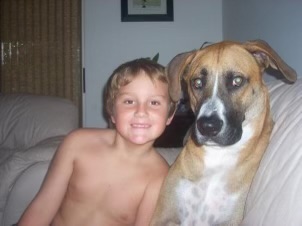 Young Sam and his childhood dog, Louie.