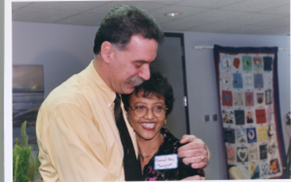 Harold and Gennet hugging after meeting for the first time to celebrate their successful kidney transplant.