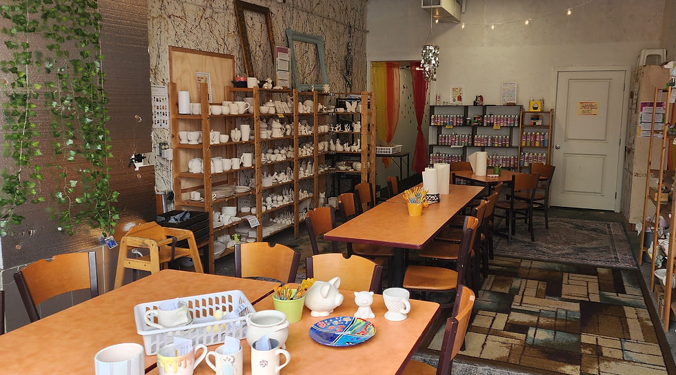 Close-up view of colorful ceramic paint pots arranged neatly