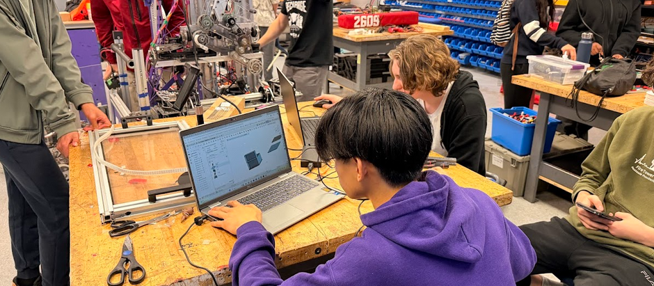 Students working on robot designs