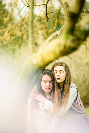 fashion nature wildlife photography portrait Two girls sitting on a tree