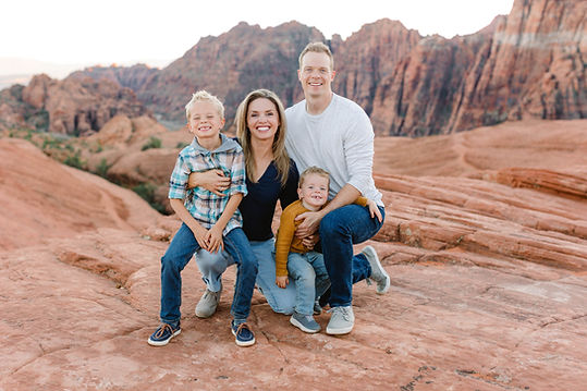 Owner of a St. George Utah mobile charcuterie bar with family, smiling together at a casual outdoor setting