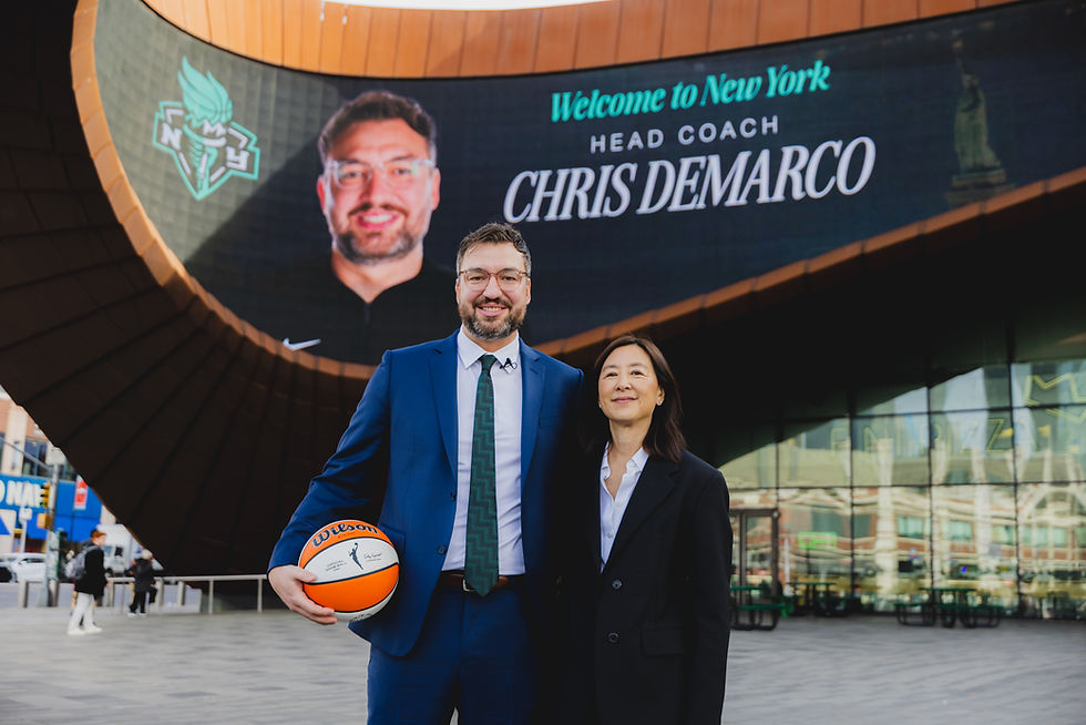 Chris DeMarco (left) and Clara Wu Tsai (right) pose in front of Barclays Center. Photo Credit: Brandon Todd/New York Liberty
