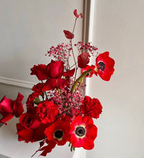 Tall red flower centerpiece for hotel lobby or corporate reception