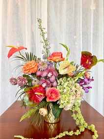 Light spring flower centerpiece for seasonal corporate conference or event