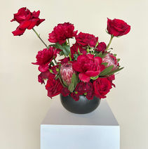 Red flower arrangement for restaurant table decor in Palm Beach