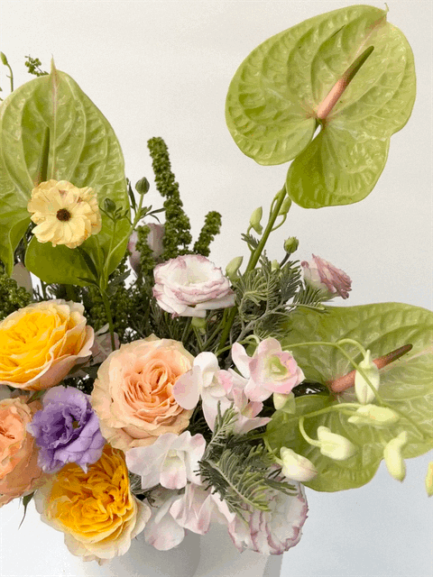 White and green floral centerpiece for office or coworking space in South Florida