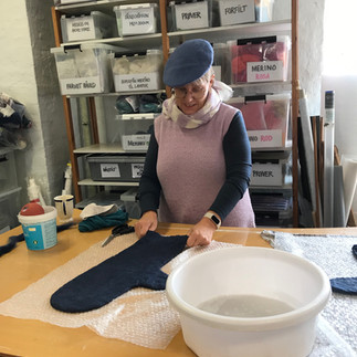 A woman during the felting process