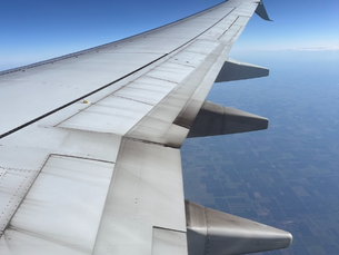 Wing of airplane flying from California to Minnesota