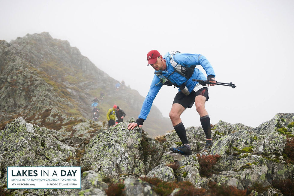 Runner coming down of Halls Fell during the Lakes in a Day running Ultra