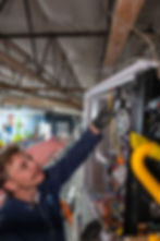 HVAC tech inspecting new commercial furnace
