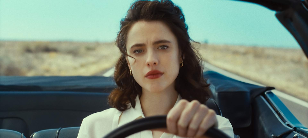 private detective Honey (Margaret Qualley) driving her blue Chevrolet convertible