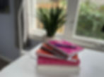 journals on a desk near window