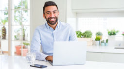 Happy man at laptop
