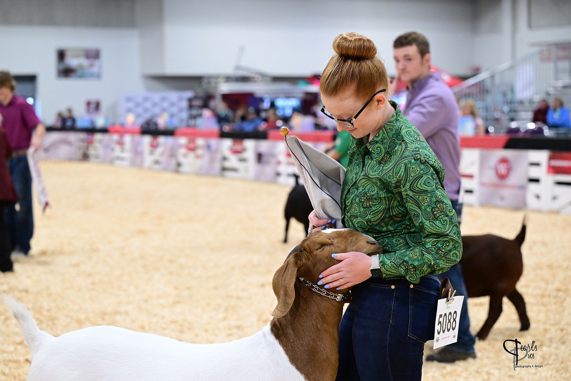 Logan Hollen with her Boer goat in the show ring.