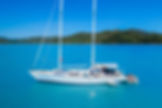 SV Summer Jo sailing yacht anchored in the turquoise waters of the Whitsundays.
