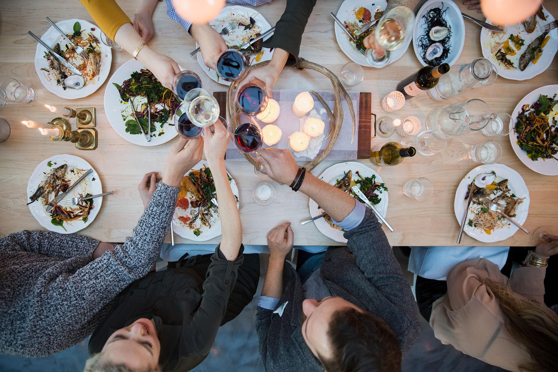 a lively group food tour through a bustling Mediterranean market with vendors and shared plates