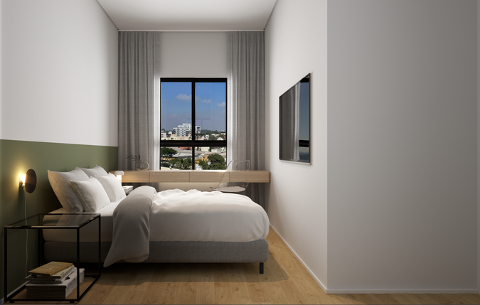 Quarto de casal com cabeceira estofada e iluminação aconchegante, projeto de interiores em Curitiba.