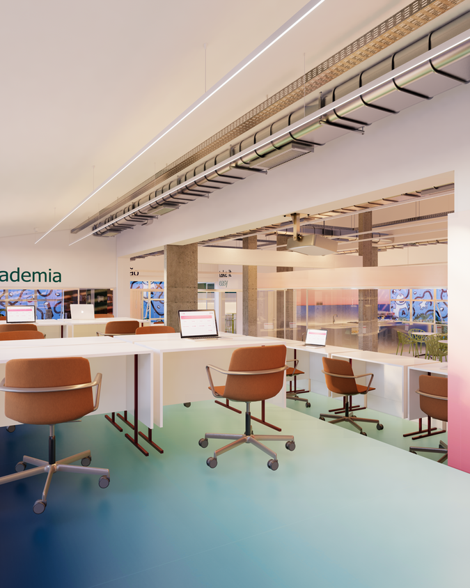 Vista do coworking do Distrito 28, destacando o design institucional e o uso flexível do espaço.