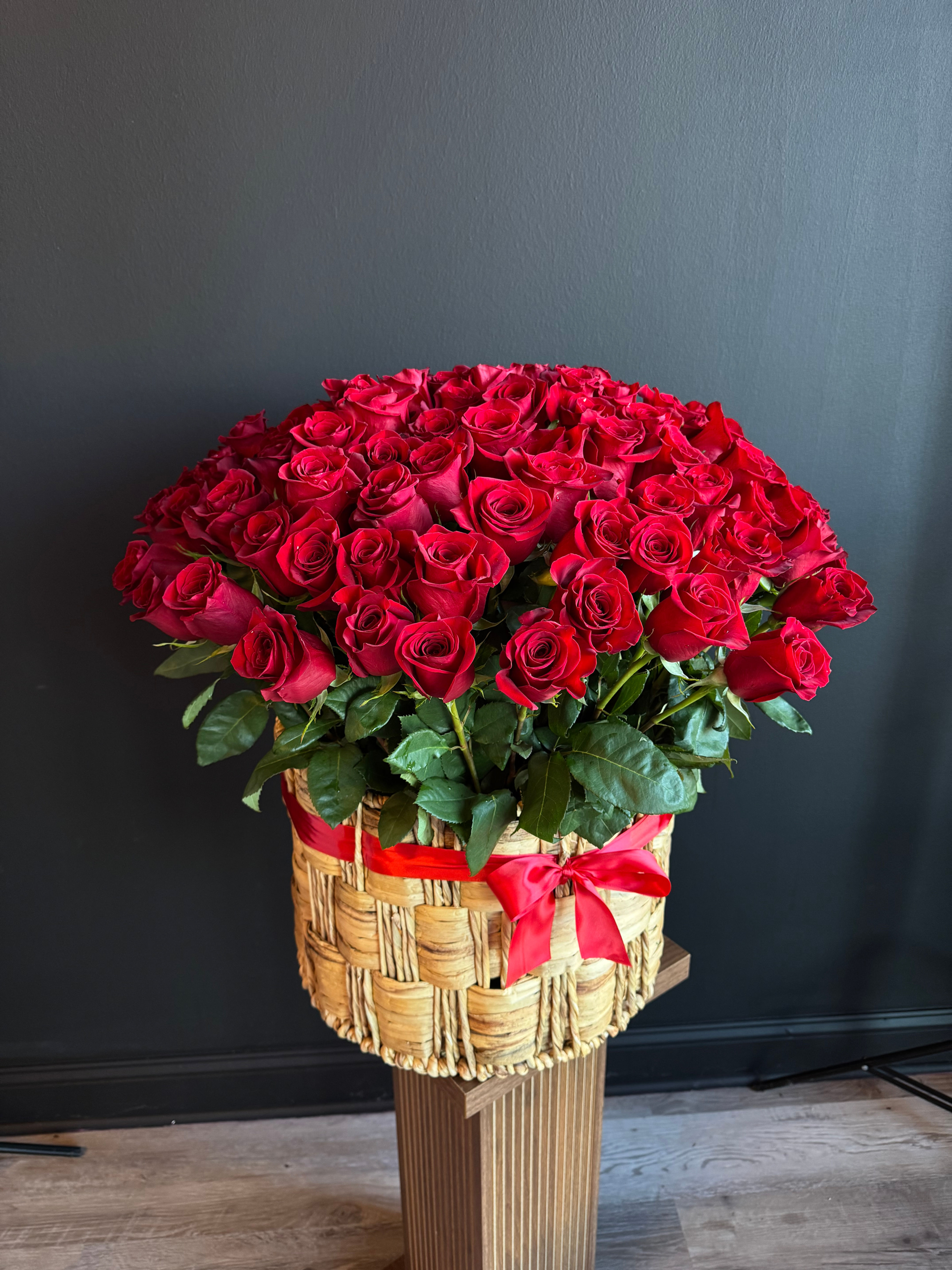 100 Red roses in a basket