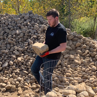 Worker making a pallet of stone