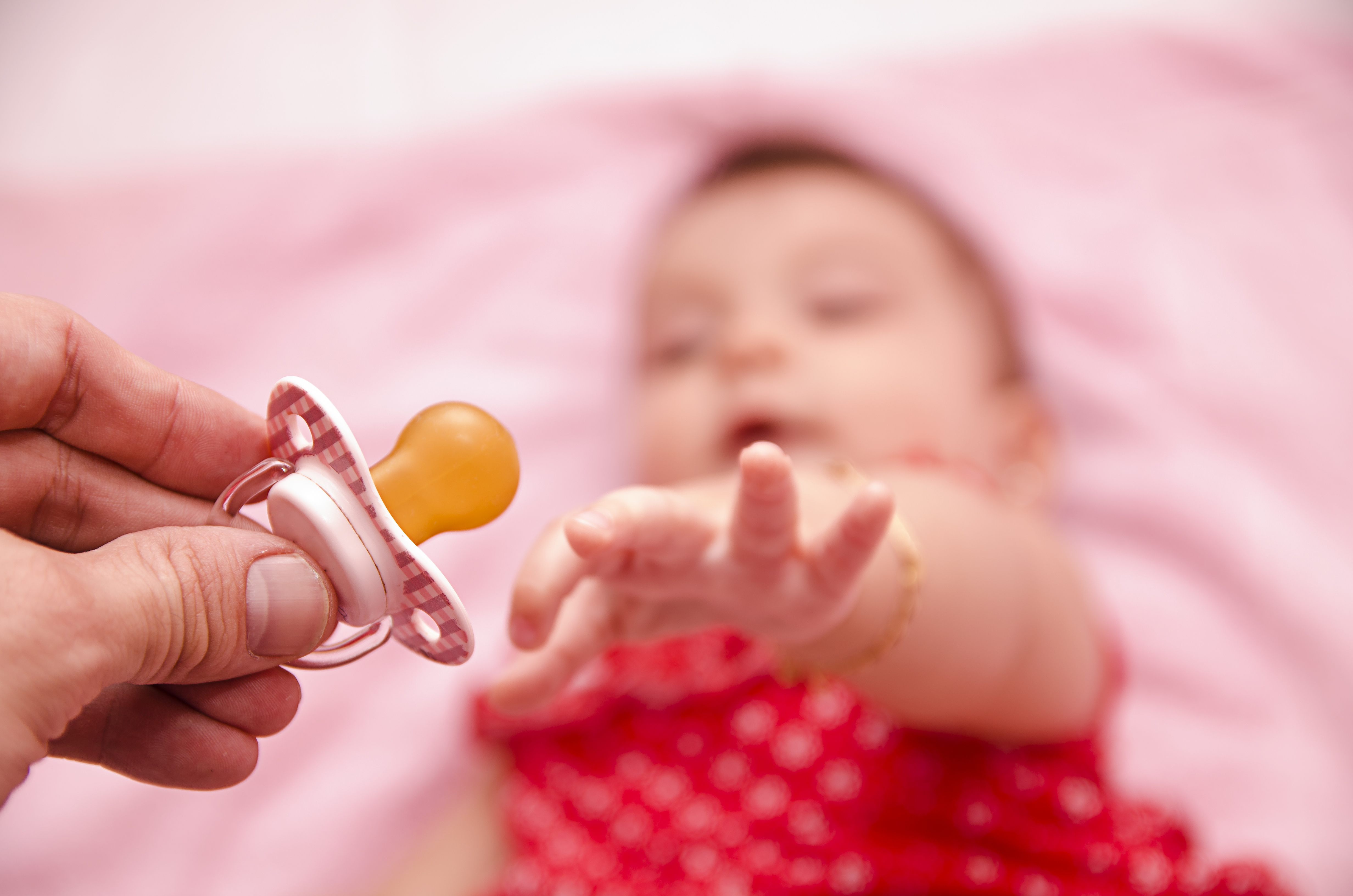 Baby Reaching Pacifier