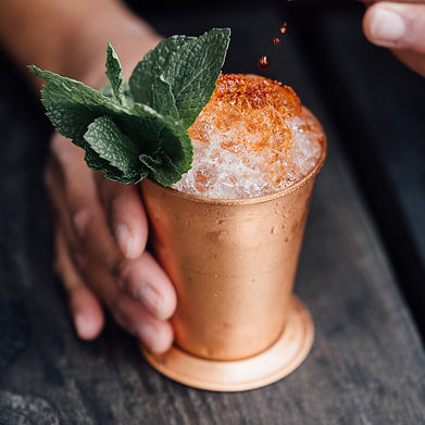 Cocktail in a copper cup with mint