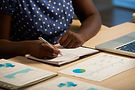 unrecognizable-black-lady-sitting-desk-office-night-writing-journal_1098-17559.jpg