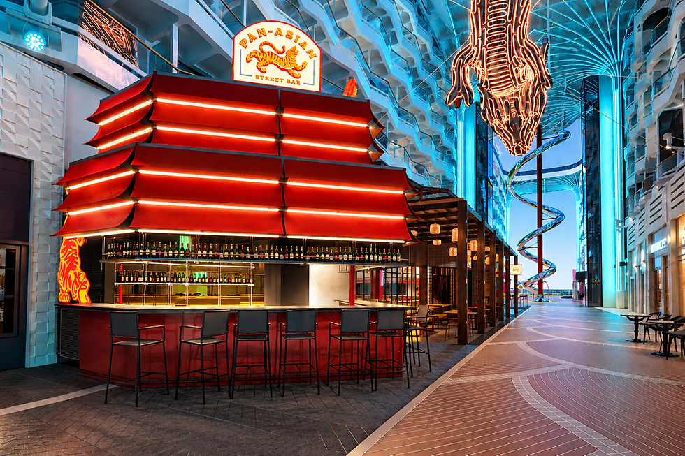 Rendering of Pan Asian Bar aboard MSC World Asia, featuring a red pagoda-inspired bar along the ship’s World Promenade with surrounding lounge seating and multi-level atrium views.