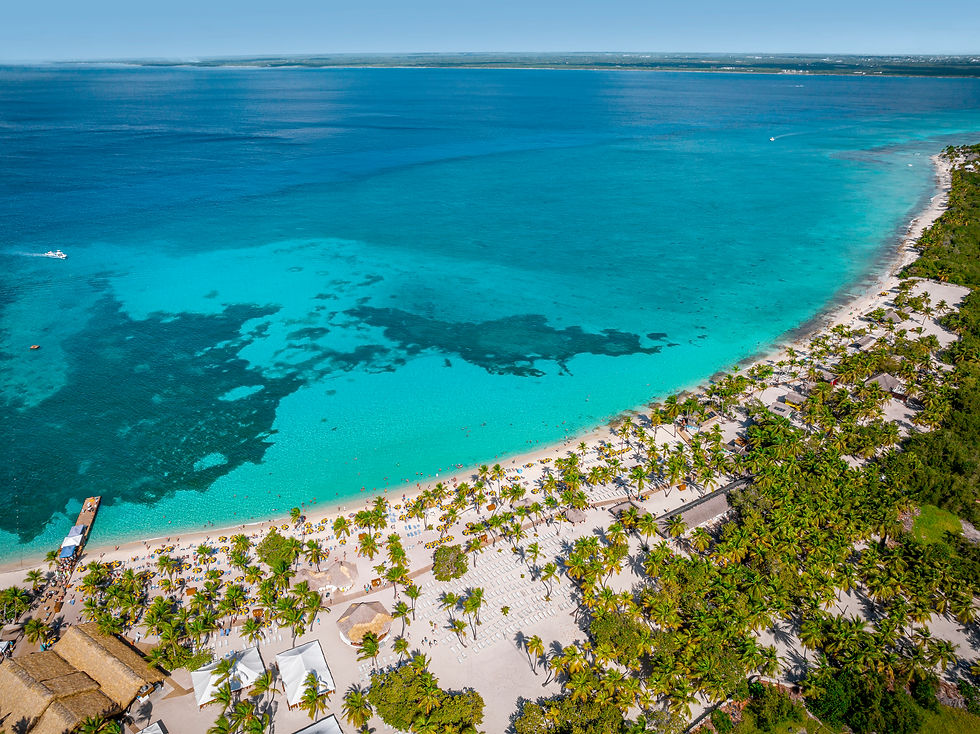 White-sand beach, palm trees and turquoise Caribbean water at Catalina Sugar Beach