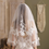 Thumbnail: The Elysia Elbow-Length Double Veil is a vision of ethereal romance, with layers of soft, gossamer fabric that gently cascade
