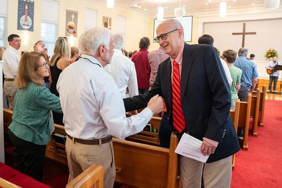 pastor (older) -2 (HERO talking w older man, smaller church in background).jpg