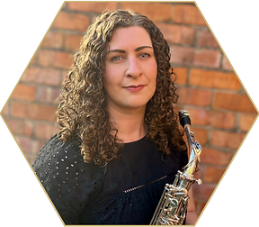 Photo of MSA Director Gillian Blair holding a saxophone