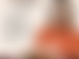 Woman smiling in orange top