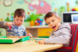 Two boys playing at table.jpeg