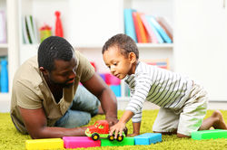 dad playing with son.jpeg
