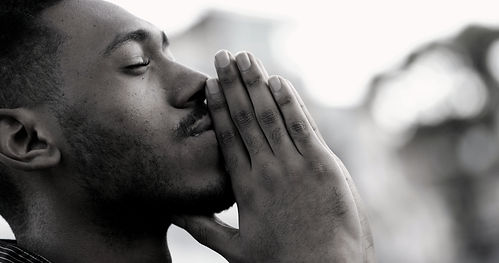 Spiritual young black African man praying to GOD_edited_edited_edited.jpg
