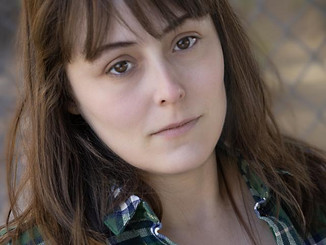 Headshot Nadie Hart plaid.jpeg