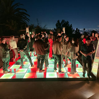 Large 20x20 LED dance floor rental setup for a ballroom event celebration