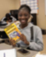 Student holding 50 things for black teens to experience before graduating high school