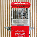 Stock image of a red popcorn stand.