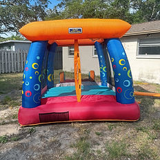 The "My 1st Jump n Play" Bounce House, which has blue pillars, and orange top, and a red slide, complete with an orange, red, and teal slide. Duration is listed for either 4 or 8 hours, starting at $35 for a daily rate.