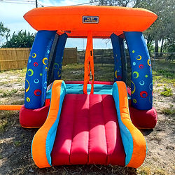 The "My 1st Jump n Play" Bounce House, which has blue pillars, and orange top, and a red slide, complete with an orange, red, and teal slide. Duration is listed for either 4 or 8 hours, starting at $35 for a daily rate.