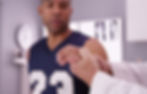 Athlete receives care from a doctor
