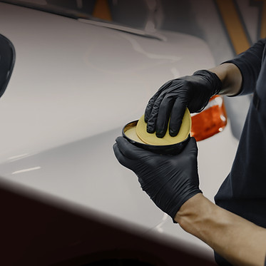 man-polish-car-garage_edited.jpg