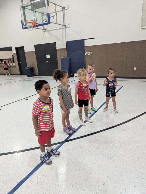 Basketball camp children in a row, Cedar Rapids, Good Shepherd